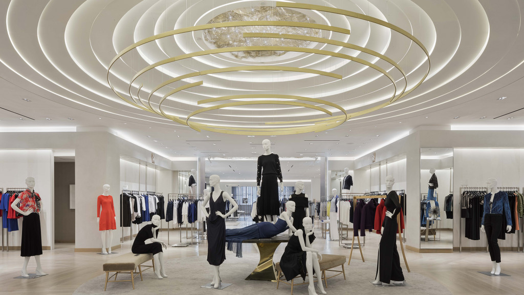 A clothing store with mannequins and clothes.